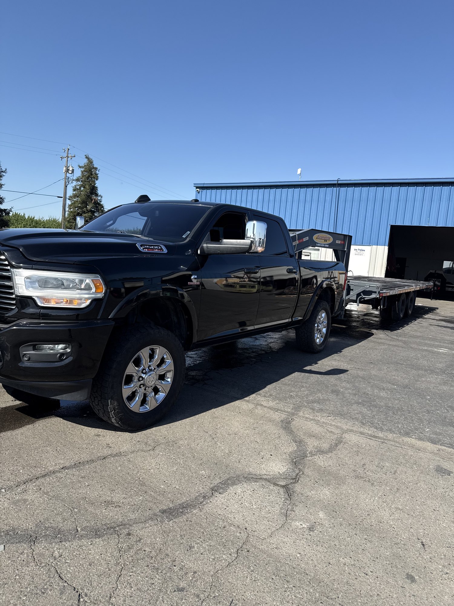 J&R Towing pickup and gooseneck trailer ready for hauling